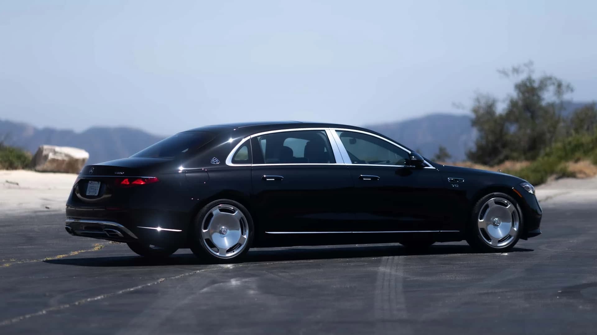 Black 2027 Mercedes-Maybach S680 seen from the rear three-quarter angle